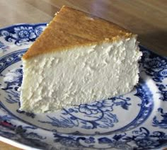 a piece of cheesecake on a blue and white plate