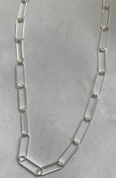 Sterling silver chain Paper clip chain Link size 6.5x20 mm Us$ 13.99 per foot Silver Chunky Chain Rectangular Necklace, Silver Rectangular Chunky Chain Necklace, Silver Chunky Chain Necklace Rectangular, Silver Paperclip Chain Bracelet With Oval Links, Silver Paperclip Bracelet With Chunky Oval Link, Silver Link Paperclip Bracelet With Chunky Chain, Silver Chunky Chain Link Paperclip Bracelet, Silver Chain Link Paperclip Bracelet, Silver Link Paperclip Bracelet With Cable Chain