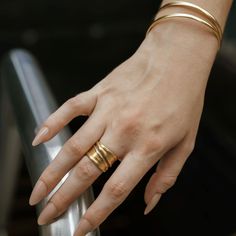 The Ozan ring is a chunky tapered banded ring (approx. 1/2").     Style Tip: Wear this as your daily standalone ring - no other hand accessories required! Material: Brass Metal, 21 Karat Gold Plated with Lacquer Coating. Stone: Lapis Lazuli  Our jewelry is handmade. Please note while pieces may be adjustable they are delicate in nature and must be adjusted gently. Everyday Jewelry With Thick Band Metal Ring, Everyday Metal Ring With Thick Band, Everyday Wide Band Ring With Open Design, Everyday Metal Jewelry With Thick Band, Adjustable Stackable Wide Band Ring For Everyday, Everyday Thick Band Metal Ring, Modern Adjustable Wide Band Rings, Stackable Rings With Wide Band For Everyday, Adjustable Wide Band Ring For Everyday