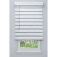 a white window blind with the blinds pulled down to allow shade for the windows in the room