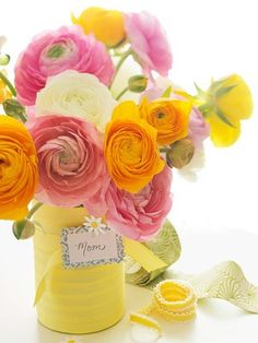 there is a bouquet of flowers in the vase on this purple and white card that says happy mother's day