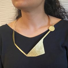 An angular study of the human figure in repose, moving, and touching. We chose brass as our only element in order to draw attention to the figure in motion. SHARE 2 - Bold Statement Necklace from the Figure Collection Gold Geometric Metal Necklace, Adjustable Geometric Gold Jewelry, Gold Geometric Metal Jewelry, Handmade Geometric Brass Jewelry, Modern Geometric Gold Jewelry, Gold Geometric Brass Jewelry, Vintage Gold Jewelry With Unique Design, Modern Pendant Necklace With Unique Variations, Handmade Geometric Gold Jewelry