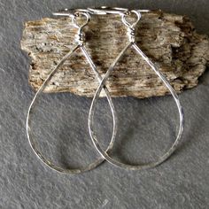 A thicker gauge sterling silver (18 gauge) is formed into tear drops, hammered for texture and then tumbled in steel shot for a brilliant shine. Ear wires are hand formed from sterling silver. Earrings measure approximately 2.25 inches from top of ear wire to bottom of tear drop. These earrings are eco friendly as the silver comes from a recycled source. The last photo shows all the different sizes together. For extra small sterling silver teardrops see-------> https://www.etsy.com/listing/48 Metal Long Drop Hoop Earrings As Gift, Everyday Metal Drop Hoop Earrings, Metal Hoop Earrings For Gift, Nickel-free Long Drop Hoop Earrings Gift, Everyday Long Drop Hoop Earrings With Ear Wire, Metal Drop Hoop Earrings With Ear Wire, Metal Teardrop Earrings With Lever Back, Nickel-free Metal Drop Hoop Earrings, Handmade Sterling Silver Drop Hoop Earrings