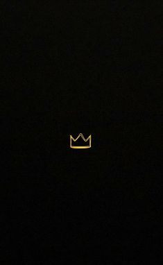 a black background with a yellow crown in the middle and one light shining on it