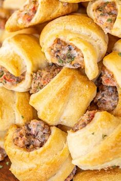 several rolls with meat and cheese on them