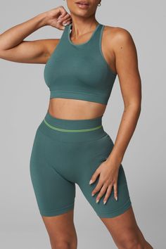 Introducing LiCi's True Form collection, a seamless activewear line that serves as a reminder to be true to yourself. Crafted with a fabric that feels silky smooth to the touch, and enhanced with a full interlocking knit construction, this collection offers the perfect combination of compression and breathability. High-Waisted No Front Seam Back Scrunch Seam Detail to Enhance Curves Ribbed Band Detail for Extra Support 6" Inseam LiCi Logo placement center top back Fabric: Seamless 90% Nylon 10% Seamless Activewear, Do Not Conform, High Neck Bra, Logo Placement, True To Yourself, Jewel Neckline, Be True To Yourself, Sports Bras, Ribbed Fabric