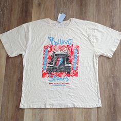 a white t - shirt with an image of a truck on it