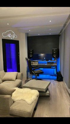 a living room filled with furniture and blue lights