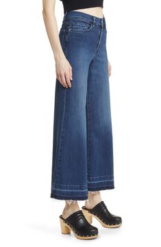 Made from superstretchy denim, these '70s-inspired palazzo jeans are remade for today with released hems and a slightly shorter inseam. 28 1/2" inseam; 28" leg opening; 12" front rise; 15" back rise (size 29) Zip fly with button closure Five-pocket style 77% cotton, 18% modal, 4% elasterell-p, 1% elastane Machine wash, dry flat Made in Turkey Dark Wash Full Length Flares For Spring, Spring Dark Wash Full-length Flares, Stretch Flares With Frayed Hem For Spring, Spring Dark Wash Full Length Flares, Denim Wide-leg Flare Jeans With Frayed Hem, Wide-leg Denim Flare Jeans With Frayed Hem, Denim Flare Jeans With Frayed Hem And Wide-leg, Spring Dark Wash Flares With Five Pockets, Spring Dark Wash Cotton Flares