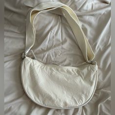 Primark Cream Crescent Bag White Canvas Hobo Bag Casual Style, Casual White Canvas Hobo Bag, Casual Cream Baguette Bag For Everyday, White Casual Satchel Hobo Bag, White Large Capacity Baguette Bag For Travel, Casual White Baguette Bag With Large Capacity, Large Capacity White Baguette Bag For Travel, White Hobo Bag For Daily Use, White Canvas Satchel Shoulder Bag