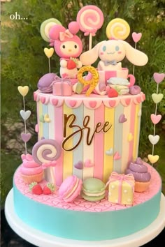 a colorful cake decorated with teddy bears and candy