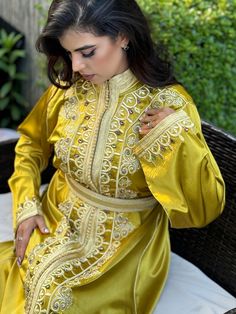 Kaftan 1 piece embroidered    Belt mdama  included    Length of the model: 160 CM   Model wears size: M / EU SIZE 38    Fabric: la soie Spring Wedding Kaftan With Dabka Work, Embroidered Kaftan For Wedding, Elegant Yellow Kaftan For Festive Occasions, Fitted Embroidered Kaftan For Eid, Gold Kaftan For Summer Festivities, Gold Kaftan For Festive Summer Occasions, Gold Summer Festive Kaftan, Eid Kaftan With Gold Embroidery, Elegant Traditional Drape Kaftan For Spring