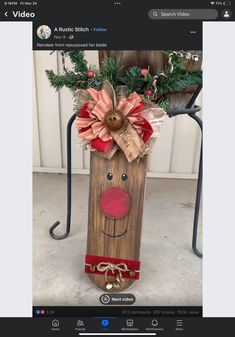 a christmas decoration made out of wood with a reindeer face on it's head