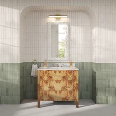 a bathroom with green and white tiles on the walls, a sink and mirror in the corner