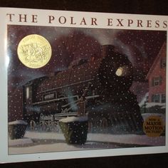 the polar express book is on display in front of a black frame with an image of a train