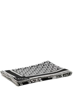 a black and white patterned tray on a white background