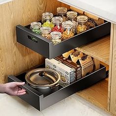 an open drawer with spices and food in it