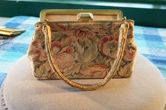 "I am offering you this vintage incredible hand crafted tapestry purse that is very similar to the Georgian style. It is 9\" wide, at its widest, and 5.5 \" tall, not counting the double handle, which would make it over 11 1/2\" long, and the depth is app 3\". There are endless amounts of etching and scrollwork.... Simply beautiful !! It features a large domed rectangle shaped yellow gold tone secure snap closure. The inside material is in excellent condition, and is a cream colored moray satin Vintage Tapestry Bag For Formal Occasions, Vintage Evening Satchel With Gold-tone Hardware, Retro Rectangular Tapestry Bags, Vintage Tapestry Shoulder Bag For Evening, Vintage Tapestry Bag For Evening, Gold Tapestry Rectangular Bag, Antique Tapestry Bags For Everyday, Vintage Tapestry Shoulder Bag For Travel, Victorian Style Rectangular Tapestry Bag