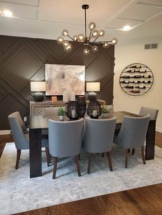 the dining room table is surrounded by gray chairs