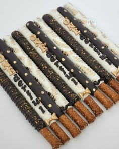 there are many pieces of cake that have been decorated with gold and black icing