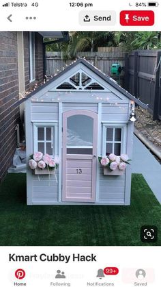 a small house made out of wood with flowers on the windows and doors is for sale at kmart cubby hack