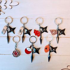 six different key chains with various designs on them