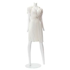 Thierry Mugler S/S 1994 White Fan Pleated Dress; with pleated gathering to central metal ring at midriff, satin-covered lightly-boned corset to interior. Fits US size 4, EU 34; Missing Label; Excellent condition. Fitted Silk Pleated Dress For Evening, Formal Ruched Silk Pleated Dress, Silk Ruched Pleated Dress For Formal Occasions, Elegant Ruched Pleated Formal Dress, Formal White Fitted Pleated Dress, White Fitted Pleated Dress For Formal Occasions, Formal Fitted Pleated Dress With Ruched Detail, Ruched Fitted Pleated Dress For Formal Occasions, Fitted Ruched Pleated Dress For Formal Occasions