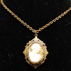 This Amazing Antique Art Deco 1920's Cameo Locket Is Adorned With Faux Petite Pearls Set In Brass. The Chain Is Also Brass 13 Inches Long And Probably Not Original Because Of Clasp. In Overall Excellent Condition For Age With Some Patina And Wear On Back Of Locket. Measure Approximately 1 3/4 Inches Tall And Under 1 1/2 Inches Wide. A Very Sophisticated Piece Of Statement Jewelry! Victorian Gold Necklace, Elegant Antique Gold Cameo Necklace, Antique Gold Cameo Locket Necklace, Bronze Victorian Locket Necklace, Victorian Brass Locket Necklace For Vintage Collection, Antique Brass Cameo Locket Necklace, Art Deco 1920s, Pearl Set, Antique Art Deco