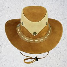 Leather Cowboy Vintage Style Hat | Cowboy Vintage Hat For those who want a simpler design, Selecto Hats offers the streamlined Tan Colored - Leather Cowboy Hat. leather from tanned cowhide,  The large brim of this hat flares upward at the sides, and it has a short, tapering crown with a slim self-leather hat band. Made by hand from 100 percent leather, Stylish & Strong. Fast Delivery, Superior Quality Assurance of Contentment Brown Leather Wide Brim Hat, Brown Leather Fedora Hat, Brimmed Leather Hats For Rodeo, Leather Brimmed Rodeo Hat, Leather Brimmed Hat For Rodeo, Brown Leather Western Hat, Brown Leather Hat With Leather Sweatband, Leather Brimmed Hats For Western-themed Events, Brimmed Leather Hats For Western-themed Events