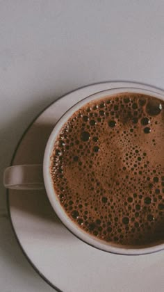 a cup of hot chocolate on a saucer