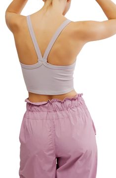 A cropped, racerback cut defines this rib camisole that's always ready for layering, lounging, lunging, lay-ups—you get the idea. 14" length (size Medium/Large) Scoop neck Racerback 87% polyamide, 13% elastane Dry clean or machine wash, dry flat By Free People; made in Turkey Spring Crop Top With Built-in Bra For Gym, Spring Sports Crop Top With Built-in Bra, Sporty Cami Crop Top With Seamless Construction, Spring Cropped Sports Bra With Built-in Bra, Sporty Seamless Cami Crop Top, Bra Friendly Racerback Crop Top For Loungewear, Sporty Bra-friendly Cami Crop Top, Sporty Cami Crop Top Bra Friendly, Sporty Bra Friendly Cami Crop Top