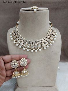 *Light Weight Kundan  necklace set with earrings and tikka. *Studded with kundan stone. *Light Weight Gold kundan necklace. * Necklace width- 1.4 inches( Included drops) *Earrings Length- 2 inches(included pearl drop) *Earrings width Size- 0.9 inches Indian Jewelry Gold, Schmuck Gold, Kundan Necklace Set, Blue Stone Necklace, Necklace Set Indian, Kundan Necklace, Kundan Necklaces, Blue Peach, Gold Jewelry Indian