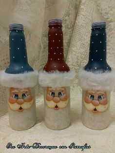 three bottles with santa claus hats on them