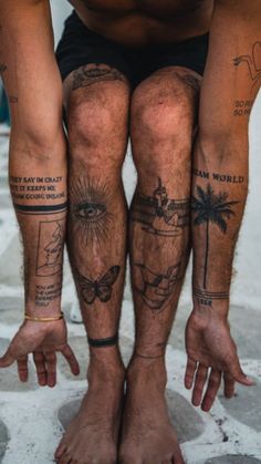 a man with two tattoos on his legs