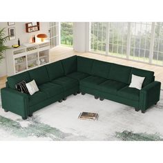 a living room with a large green sectional couch