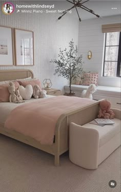 a bed room with a neatly made bed and two teddy bears