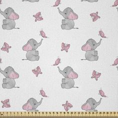 an elephant and butterfly print on white fabric