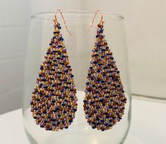 Beautiful and bright colored glass Czech seed bead earrings are woven in a teardrop pattern with and finished with a rose gold ear wire and accents. Large and fun. I'm always happy to customize if you have something specific in mind. All items are handmade by yours truly and come from a smoke free home. Thanks for looking! Nickel-free Teardrop Beaded Earrings For Party, Jewelry Statement, Teardrop Beads, Gold Copper, Copper Metal, Bead Jewelry, Brick Stitch, Seed Bead Earrings, Seed Bead Jewelry