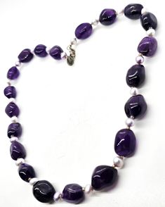 21st and stone signed Amethyst and pearl beaded sterling silver necklace. Good used condition with little to no signs of normal wear. Hang tag off clasp states 21st and Stone 925. Each amethyst nugget is alternating with light lavender pearl beads with Czech bead spacers. Acid tests positive for sterling silver. Gemstones tested with Presidium II gemstone tester. Necklace measures 18 inches long. Purple Pearl Single Strand Jewelry, Purple Pearl Single Strand Necklace, Purple Single Strand Pearl Jewelry, Purple Amethyst Pearl Necklace, Purple Pearl Jewelry With Gemstone Beads, Purple Amethyst Pearl Necklace With Gemstone Beads, Purple Amethyst Gemstone Beads Pearl Necklace, Purple Pearl Jewelry With Natural Stones, Purple Beaded Necklaces For Formal Occasions