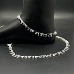 Name of product: 925 Sterling Silver Light Weight Anklet / Silver Payal Weight: 19 grams. Length: 26.8centimeter -----Feedback::- A satisfied customer is our top priority and your feedback forms the backbone of our success. Don't forget to give positive feedback along with good ratings. Thank You Silver Anklets With Latkans As A Gift, Silver Sterling Silver Anklets For Parties, Elegant Silver Anklets With Latkans, Bride Payal, Payal Silver, Payal Designs Silver, Silver Payal, Anklet Silver, Anklet Designs