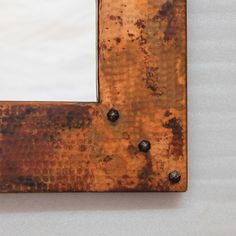 an old rusted metal frame with rivets on it