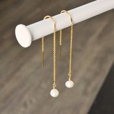 14 Gold Filled chain earrings ✨ . What is gold filled? 14K Gold-Filled jewelry is made with a solid layer of 14K Gold bonded to another base metal, the layer is a lot thicker than any high-quality Gold-plated jewelry, so it can be worn for a very long time without tarnishing. 14K Gold-Filled jewelry looks just like 14K Gold jewelry so it is an affordable alternative to solid 14K Gold jewelry. . Shipping Free shipping in orders of $35 or more. All orders will be processed and packaged within 1-2 Dainty Pearl Charm Dangle Threader Earrings, Dainty Dangle Threader Earrings With Pearl Charm, Delicate 14k Gold Filled Threader Earrings, Delicate Gold Pearl Threader Earrings, Dainty Pearl Charm Threader Earrings Gift, Dainty Threader Earrings With Pearl Charm As Gift, Minimalist Pearl Chain Threader Dangle Earrings, Dainty Pearl Dangle Threader Earrings, White 14k Gold Filled Dainty Threader Earrings