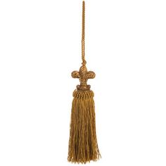 a gold tasselle hanging from a rope