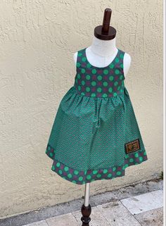 These gorgeous girls dresses are designed and produced in Observatory, Cape Town. Each one is handmade from traditional South African Shwe Shwe fabrics. We currently only have one of each size/pattern mix making each piece even more unique! Fabrics soften with washing, cold wash only XS: 0-12 months depending on the child. S: 12- 24 months depending on the child. M: 2-4 years depending on the child. L: 4-6 years depending on the child. XL: 6-8 years depending on the child. custom sizing and orde Traditional Green Dresses With Ruffles, Green Cotton Dress For Babies, Green Cotton Dress For Dress-up, Traditional Cotton Dresses With Ruffles, Seshweshwe Dresses, Shwe Shwe Fabric, Sepedi Traditional Dresses, Pattern Mixing, Size Pattern