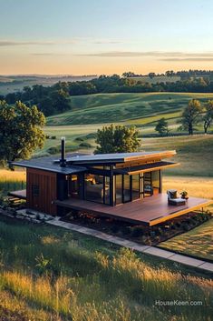 a small house in the middle of a field