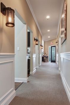 the hallway is clean and ready for guests to use it as a hotel lobby or office