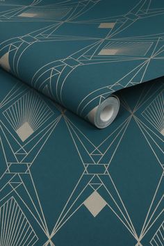 a blue wallpaper with an art deco design on it's side and white lines