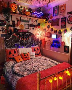 a bedroom decorated with halloween decorations and lights