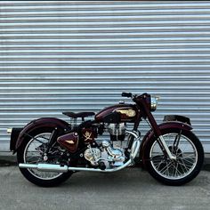 a motorcycle parked in front of a garage door