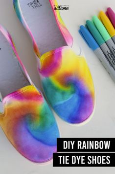 rainbow tie dye shoes with crayons next to them